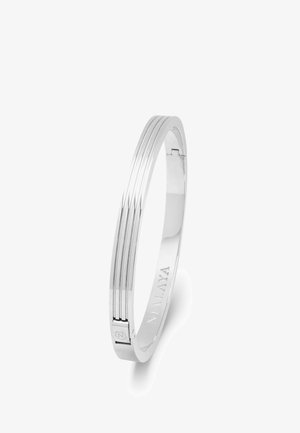 Silver bangle with a smooth finish, featuring three parallel grooves and a subtle clasp. Engraved logo detail inside the band.