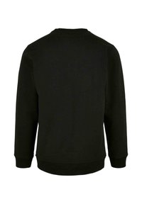 Felpa nera con colletto tondo, maniche lunghe e polsini a costine. Texture liscia, design minimal, senza loghi o motivi visibili.