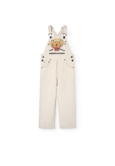 Beige overall met een relaxte pasvorm, voorzien van verstelbare schouderbanden, voorzakken en een kleurrafische afbeelding van een beer met tekst op de borst.
