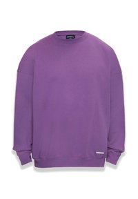 Lila Crewneck-Sweatshirt aus weichem Baumwollstoff. Mit gerippten Bündchen und Saum, sowie einem kleinen silbernen Etikett an der unteren Seite.