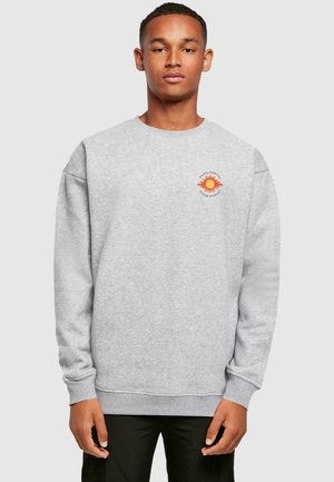 Gray sweatshirt with a crew neckline, dropped shoulders, and ribbed cuffs. Features an orange sun graphic on the left chest area.