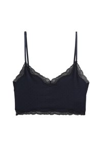 Bralette en dentelle marine foncé avec des bretelles réglables fines et une texture à pois sur le tissu, avec des bords festonnés le long de l'encolure.
