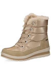 Bottes d'hiver beiges à finition brillante, avec doublure en fausse fourrure, tige rembourrée et design à lacets. Comprend des œillets en métal et une semelle en caoutchouc.