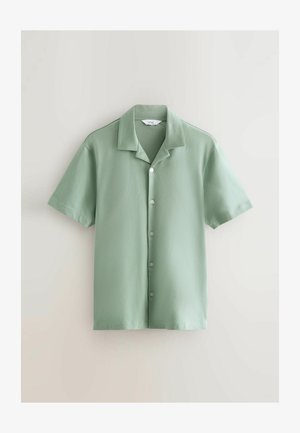 Short-sleeve, button-up shirt in soft green fabric. Features a collar, six buttons down the front, and a straight hem. Smooth texture.