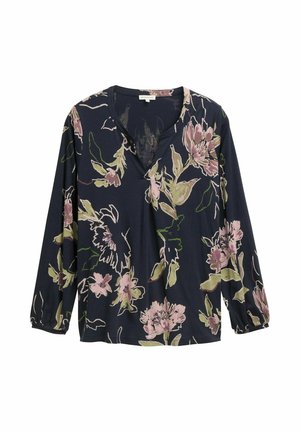 Blouse florale bleu marine avec décolleté en V, manches longues et coupe décontractée. Présente des motifs de fleurs roses et vertes sur un textile doux.