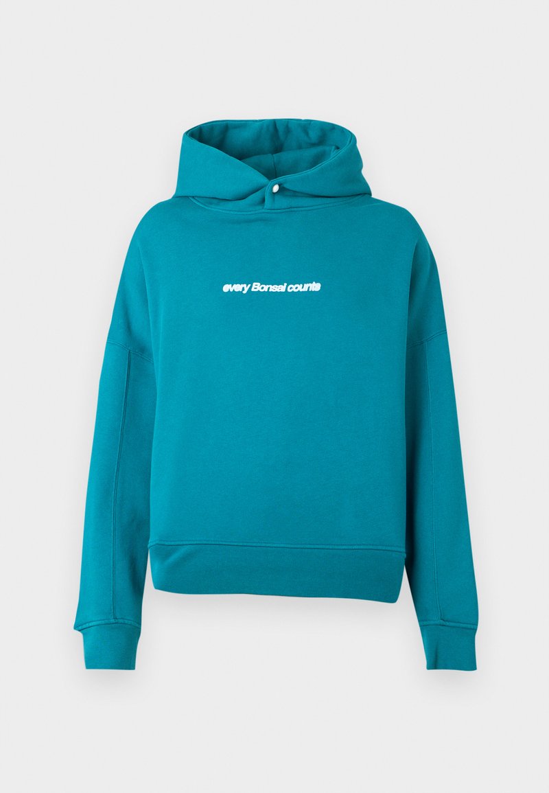 Turquoise hoodie with a high neckline, oversized fit, and white text reading "every Bonsai counts" on the front. Soft cotton material.