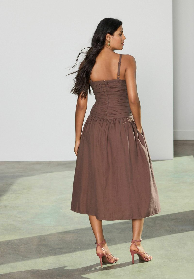 kylie jenner brown suede dress Adriana Ruched Midi Dress in Black main image 1