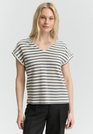 Haut à manches courtes rayé avec un décolleté en V, fabriqué à partir d'un tissu tricoté texturé en crème et bleu marine. Lignes épurées et coupe décontractée.