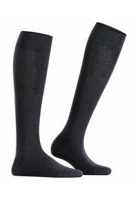 Calze nere fin sopra il ginocchio realizzate in un tessuto morbido e liscio con una leggera lucentezza. Presentano aree rinforzate sulle punte e sui talloni. Design semplice senza motivi.
