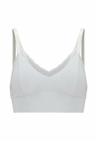 Bralette bianco realizzato in morbido tessuto, con un bordo in pizzo lungo il colletto, dotato di spalline larghe e di un design senza cuciture per il massimo comfort.