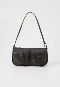 Black synthetic handbag with adjustable strap, two front pockets with buckle accents, smooth texture, and rectangular shape.