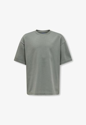 Enkel olivengrøn oversized kortærmet bomulds-T-shirt med rund hals og synlige syninger på ærmer og kant.