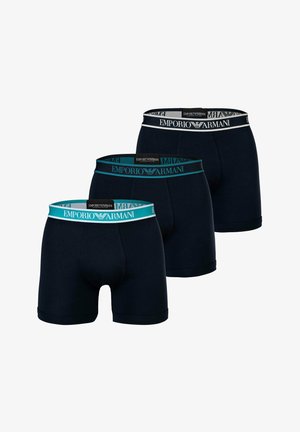 Drie paar marineblauwe boxershorts met elastische tailleband en het logo van "Emporio Armani". Zacht stof met een snug fit en een gladde textuur.