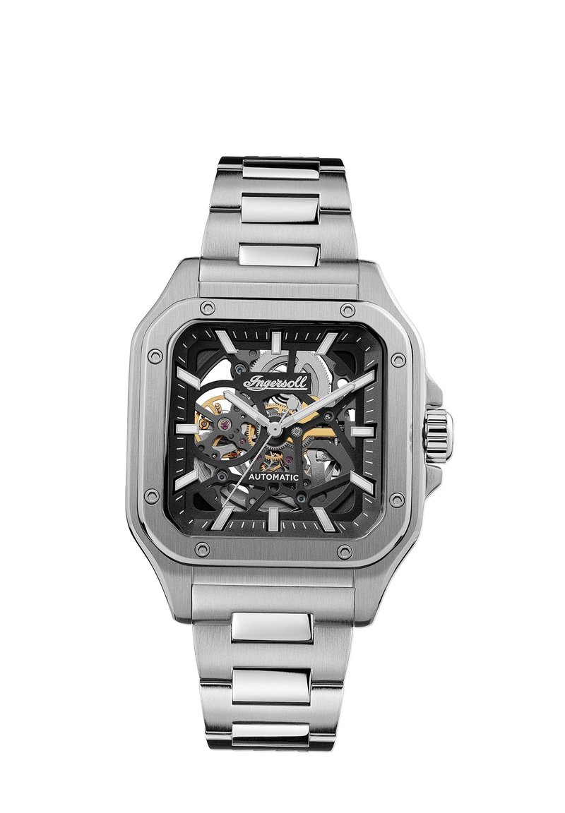 Square automatic watch with a transparent black dial showing internal workings. Stainless steel case and bracelet, silver accents and markers.