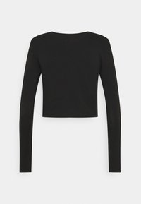 Černý dlouhý rukáv crop top vyrobený z měkkého materiálu, s kulatým výstřihem a přiléhavými rukávy s čistými okraji.