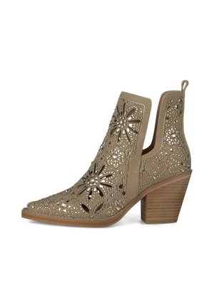 Taupe suede ankle boot with floral cutouts, silver studs, pointed toe, and block wooden heel.