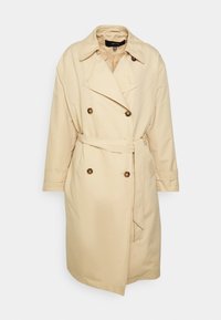 Beige double-breasted trench coat with wide collar, belt at waist, long sleeves, and tortoiseshell buttons, displayed on a white background.