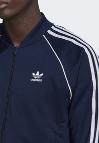 adidas Originals Športna jopa s kapuco na zadrgo - blue