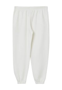 Pantalon de survêtement blanc en tissu doux avec un waistband élastique et des poignets froncés aux chevilles, présentant un design simple et sans motifs visibles.