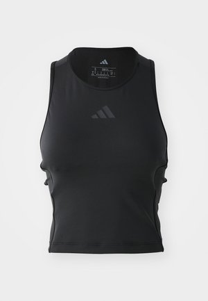 Débardeur de fitness noir, court, fabriqué en tissu lisse et extensible ; présente un col rond et un petit logo réfléchissant à l'avant.