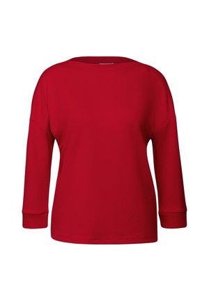 Haut rouge à manches longues en tissu doux, avec un col large et des poignets côtelés, offrant une coupe décontractée et une texture lisse sur l'ensemble.