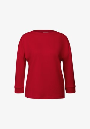 Haut rouge à manches longues en tissu doux, avec un col large et des poignets côtelés, offrant une coupe décontractée et une texture lisse sur l'ensemble.