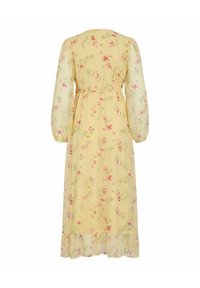 Robe midi jaune à manches longues avec imprimé floral rose et vert, manches bouffantes transparentes, taille cintrée et ourlet à volants vue de dos.