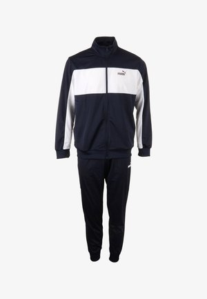 Tuta da ginnastica blu navy con una striscia orizzontale bianca sul petto. Realizzato in tessuto liscio, presenta una giacca con zip e polsini e vita elasticizzati.