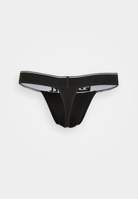 Czarne stringi z cienkim elastycznym paskiem w pasie, ozdobione kontrastowym białym logo. Miękka, gładka tkanina, zaprojektowana dla minimalnego krycia.