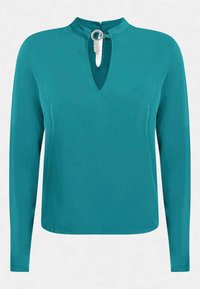 Maglia a maniche lunghe in teal di tessuto morbido, con scollatura a chiave e un accento argentato, arricchita da una delicata dettagli di perline.