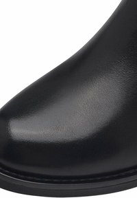 Black, glossy leather ankle boot with a sleek design, pointed toe, and flat rubber sole. Reinforced stitching around the base.