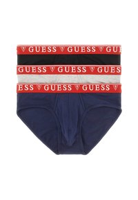 Drei Paare Herrenunterhosen mit einem roten "GUESS"-Logo-Bund. Farben: marineblau, schwarz und grau. Weiches Baumwollmaterial mit glatter Textur.