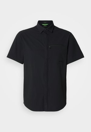 Short-sleeve black shirt made of textured fabric. Features a front zipper pocket and button-down collar. Clean, modern design.