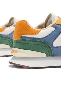 Multi-colored sneaker featuring suede in orange, blue, green, and cream. Includes a textured panel and a white midsole with orange accent.