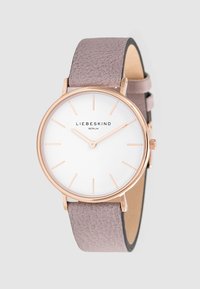 Orologio rotondo con cassa in acciaio inossidabile rose gold, quadrante bianco e cinturino in pelle beige con finitura testurizzata. Design minimalista con indicatori delle ore a index.