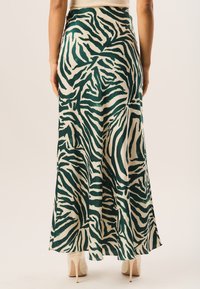 GINI LONDON ZEBRA BIAS - Maxi skirt - green