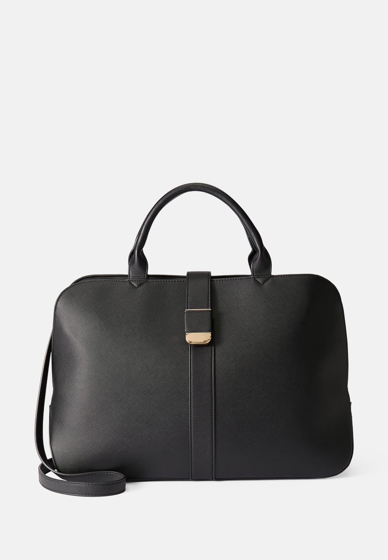 Sākotnēja melna struktūras soma, kas izgatavota no teksturēta materiāla, ar divām rokturiem, noņemamu plecu siksnu un zelta aksesuāru aizdari.