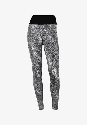 Black and white leggings featuring a textured reptile skin pattern, smooth fabric, and an elastic waistband for a snug fit.