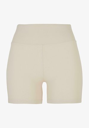 Beige high-waisted shorts van een soepele, rekbare stof. Kenmerken zijn een strakke pasvorm en een lengte tot halverwege de dijen, zonder zichtbare naden of patronen.