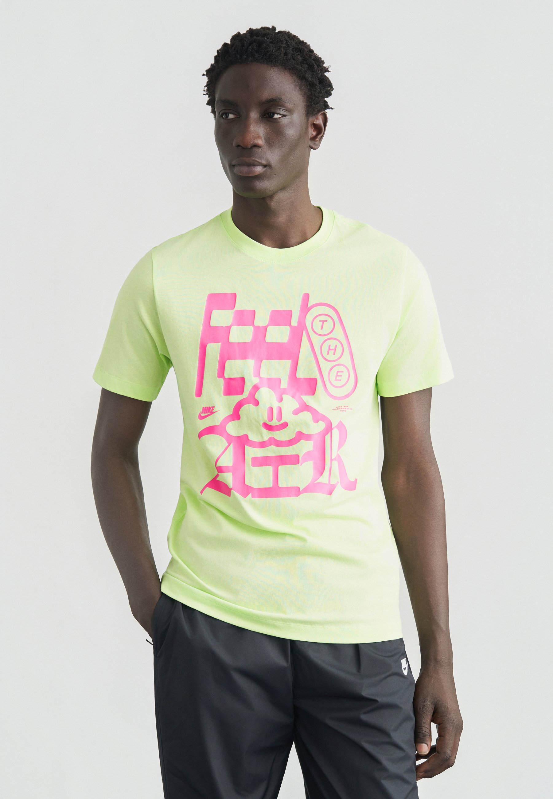 lime green and pink nike shirt