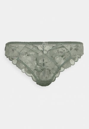 Spitzenunterwäsche in Olivgrün mit floralen Mustern, gewellten Kanten und einem zarten Bogen-Detail in der Taille. Weicher, transparenter Stoff.