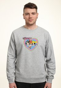 Grå sweatshirt i bomullsblandning, med en grafik av tre tecknade figurer i form av ett hjärta. Ribbad ärmslut och nederkant.