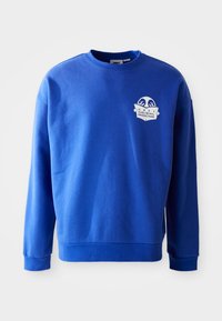 Felpa blu in cotone con colletto rotondo e maniche lunghe. Presenta un'etichetta con logo bianco sul petto e polsini e orlo a coste.