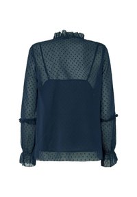Blusa trasparente blu scuro con motivo a pois, collo arricciato, maniche lunghe e polsini a balze. Tessuto texturizzato con un aspetto liscio.
