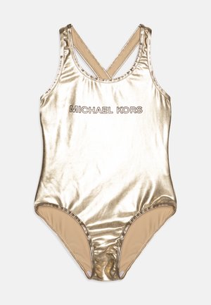 Kultainen metallinen kokonaisuus uimapuku, jossa on ristikkäiset hihnat ja etuosassa tummalla fontilla teksti "MICHAEL KORS". Luistamaton pinta.