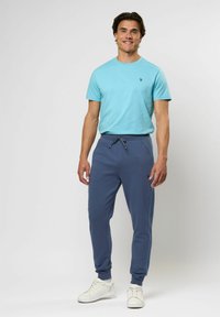 U.S. Polo Assn. TANO - Spodnji deli trenirk - vintage indigo