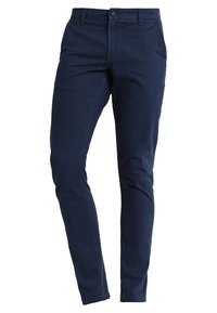 Tmavě modré bavlněné kalhoty. Slim fit střih s pětipocketovým stylem, přední knoflík a zip. Hladká textura s minimálním šitím.