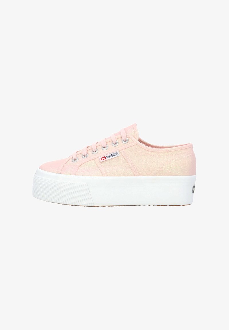 Light pink canvas sneakers with a textured finish, white platform sole, silver eyelets, and logo patch on the side.