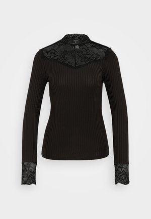 Črn rebrast dolg rokav s čipkastimi detajli na ovratniku in zapestjih. Ima visok izrez in prilegajoč dizajn.