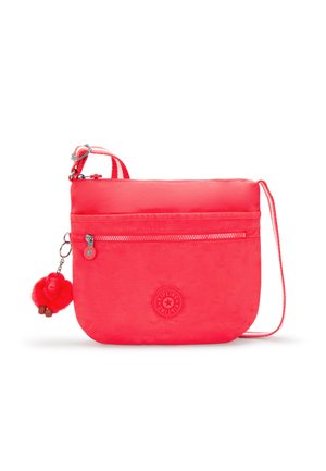 Red nylon crossbody bag with a zippered compartment, embossed logo, and a monkey-shaped plush keychain attached for decoration.